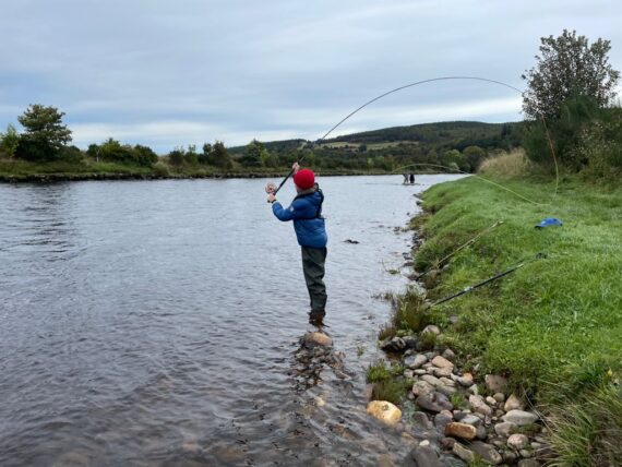 one participant putting a bend in the rod