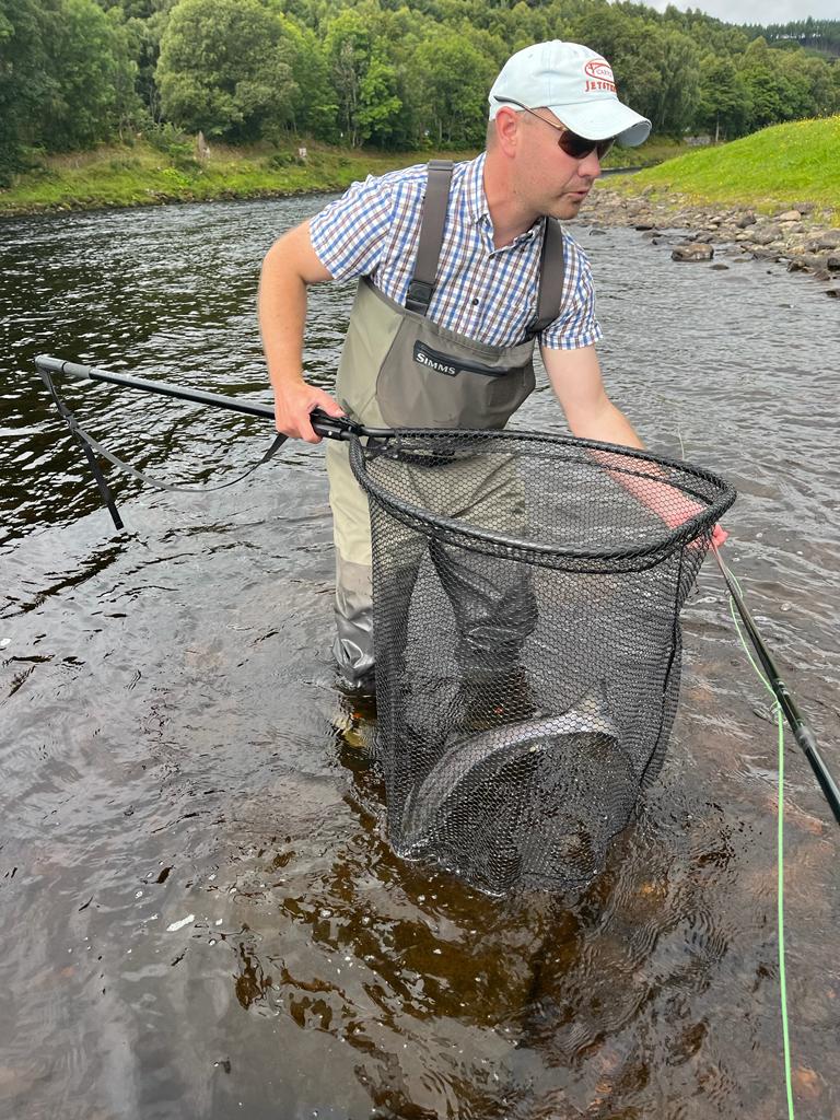 Neil-with-Gails-fish-safely-in-the-net.jpg